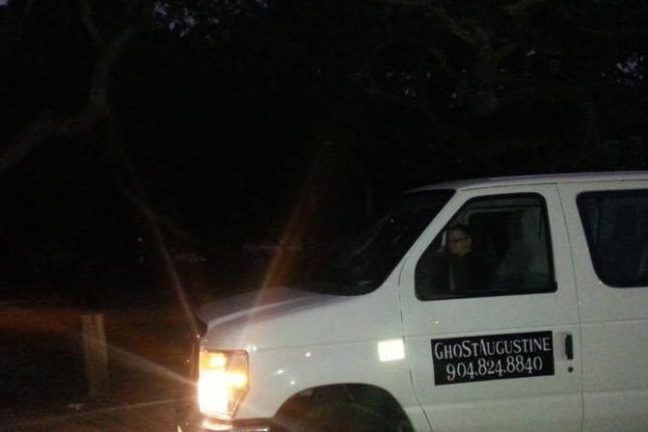 a car parked in a parking lot at night