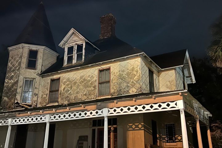 a small clock tower in front of a building