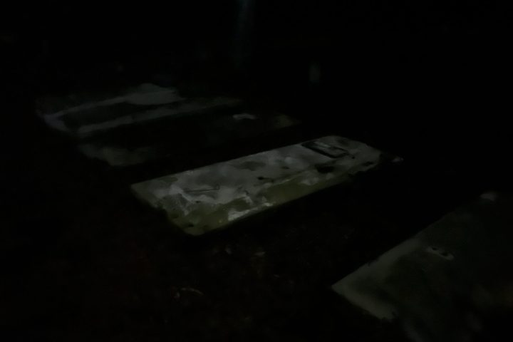 a bed in a dark room