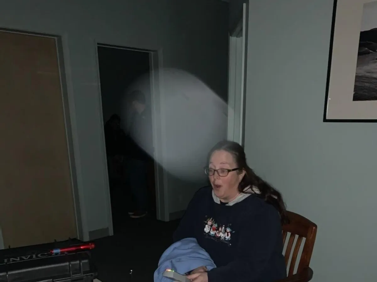 a man sitting at a table in a room