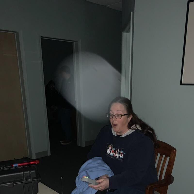 a man sitting at a table in a room