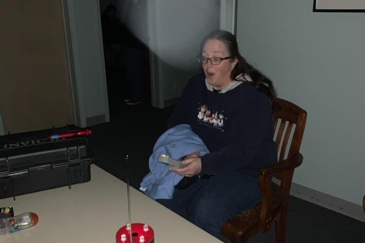 a man sitting at a table in a room