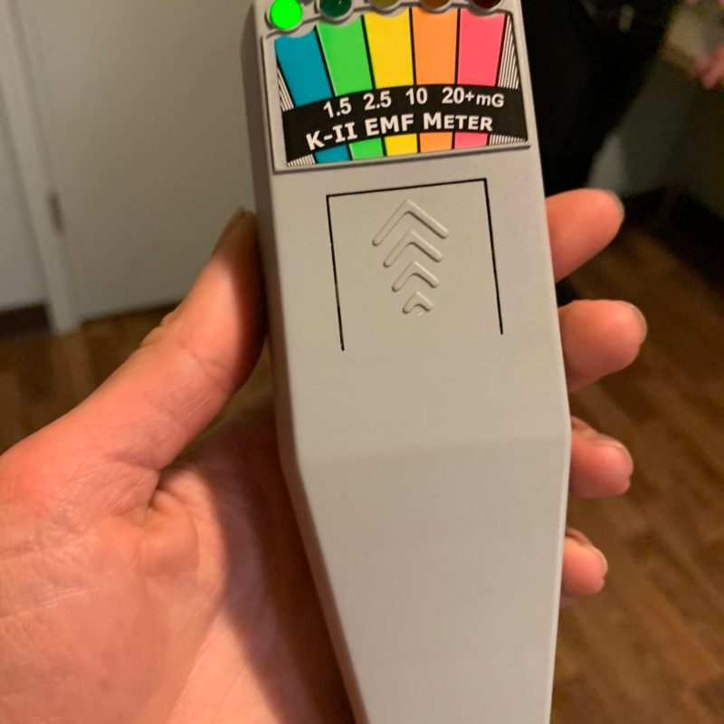 a hand holding a remote control
