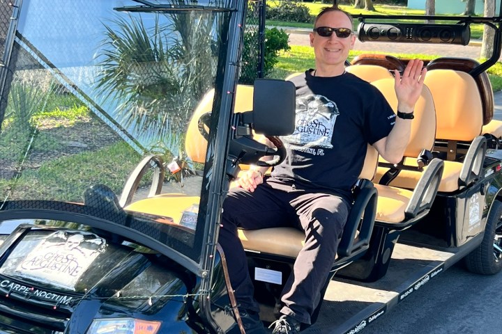 a man riding on the back of a truck