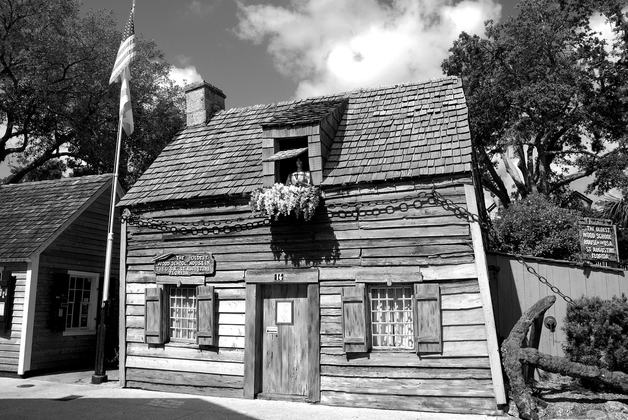 oldest-wooden-schoolhouse-3613442_1280 a bench in front of a house