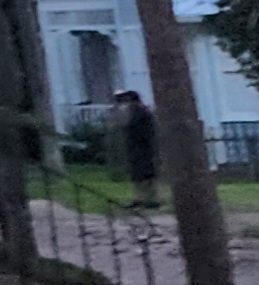 unknown(2) a person standing next to a tree