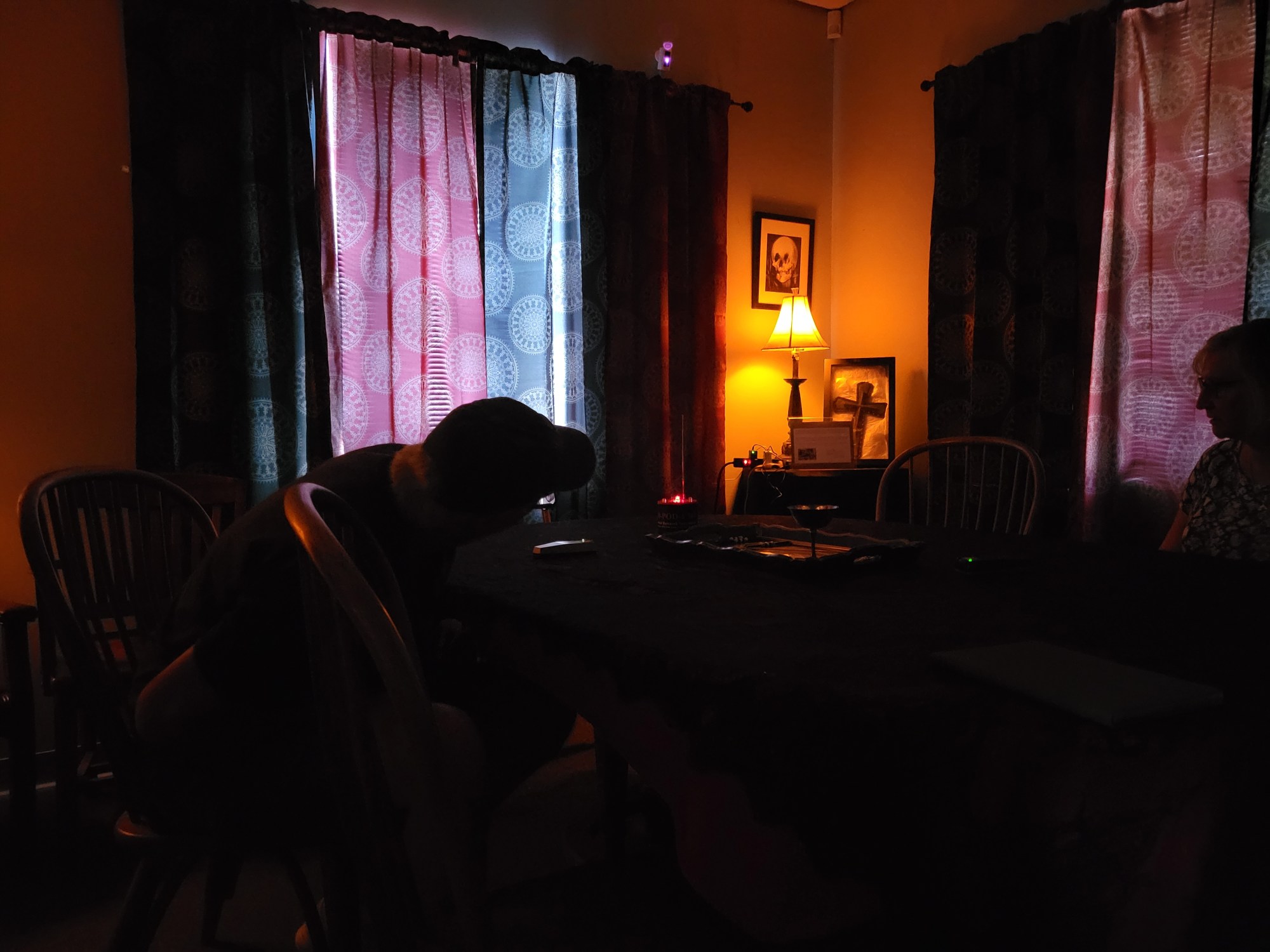 Dixie House may24 a person sitting in a dark room